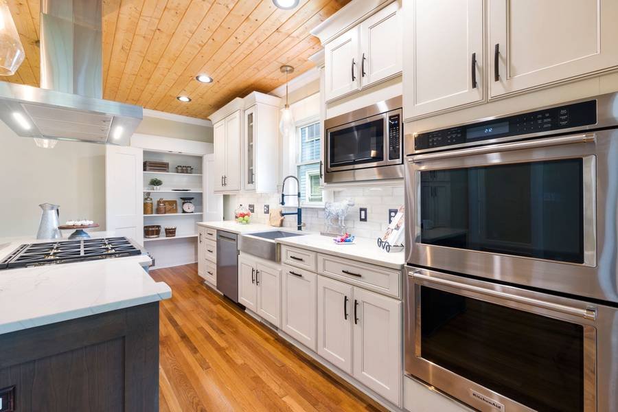 A bright, move-in-ready kitchen with white cabinets