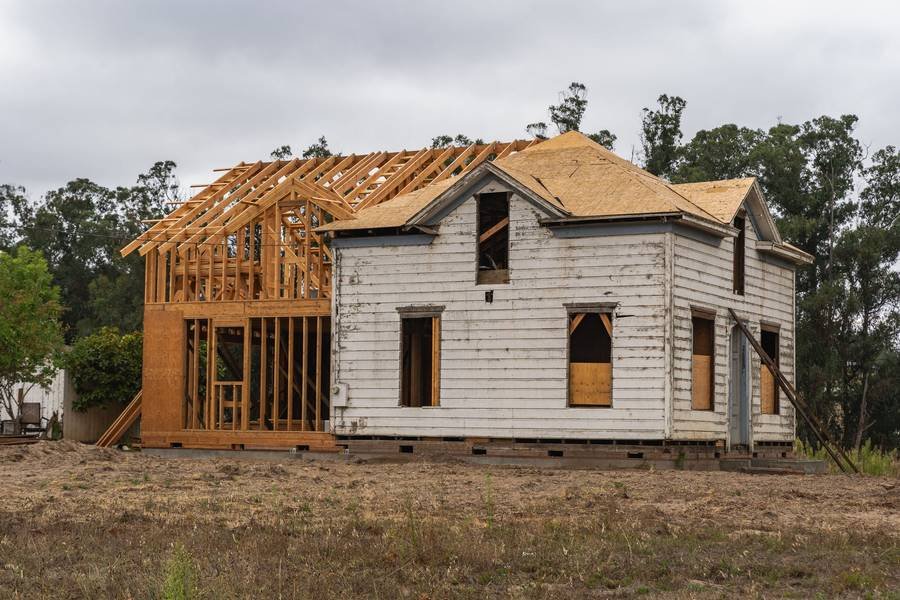 An old house opened up to new framing inside