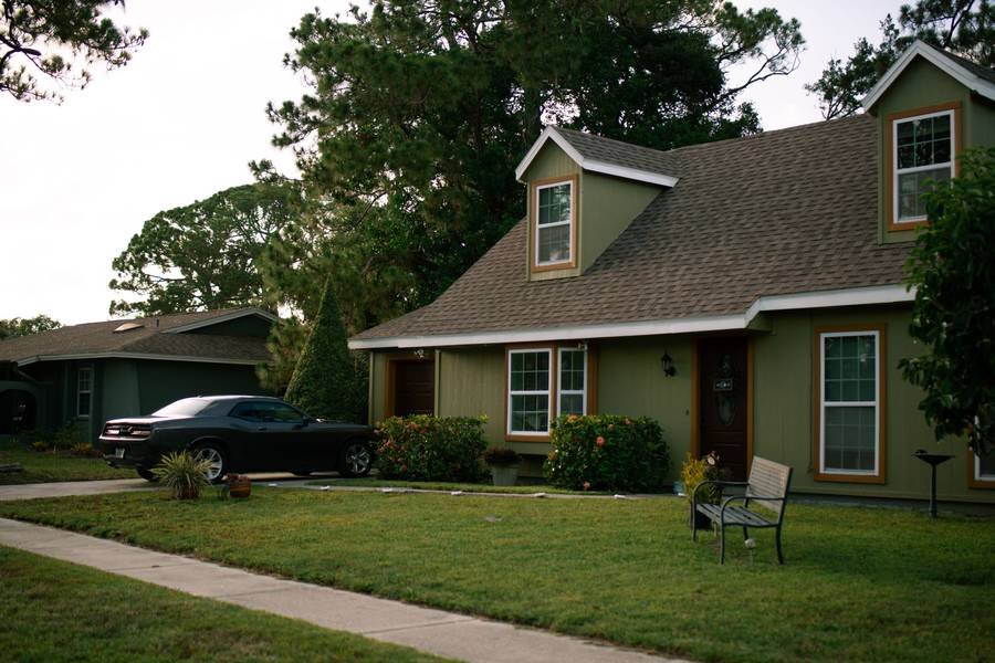 A suburban house with a green lawn